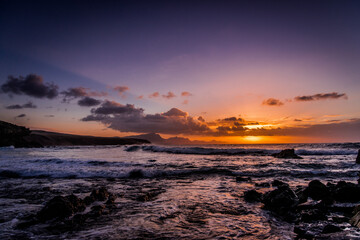 Waves and sunset at the coastline of Fuerteventura