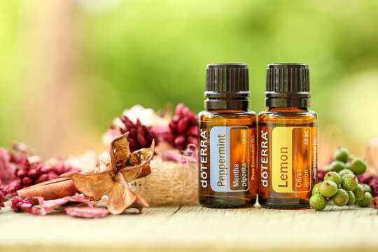 Mudgee, New South Wales / Australia - October 19 2020 - Illustrative editorial image of doterra essential oils in outdoor setting with natural bokeh background, lemon and peppermint