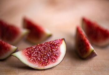 Fresh juicy figs cut in slices, closeup view.