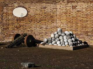 A pile of ancient cannon balls at Sant'Angelo Castle in Rome, Italy
