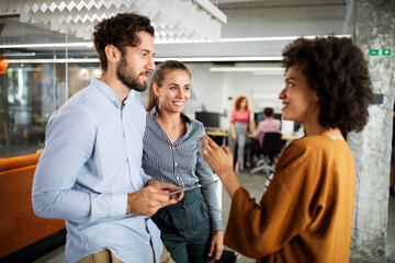 Group of business people collaborating on project in office