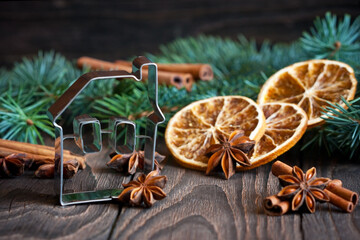 Cookie cutter and Christmas  spices with fir tree branches