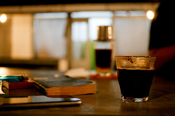 Fototapeta na wymiar glass of coffee on the table at night