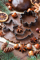 Christmas  background with cookies cutters, fir tree and  spices