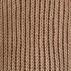 Knitted texture background. Knitting pattern of wool. Knitting. Texture of woolen fabric for wallpaper and abstract background.