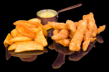Delicious fish and chips and sauce with reflection,