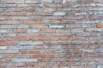 Fototapeta premium old brick wall of bricks of different sizes as background