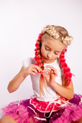 cute girl in bright colorful clothes braids pigtails