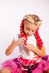 cute girl in bright colorful clothes braids pigtails