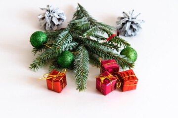 Christmas decoration on a white background. Christmas gifts and golden Christmas balls. Place for your text.
