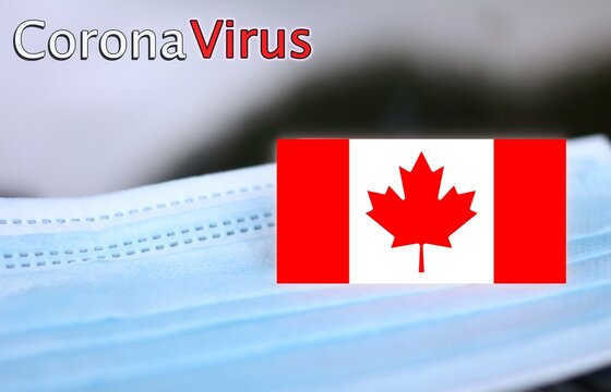 close up of a surgical mask with the canadian flag, concept of Corona Virus in Canada