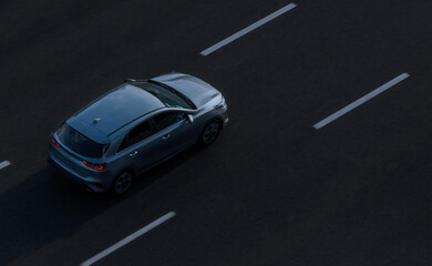 Fototapeta na wymiar Saint Petersburg, Russia - July 25, 2020: Top view of one car on an empty road photographed from a height