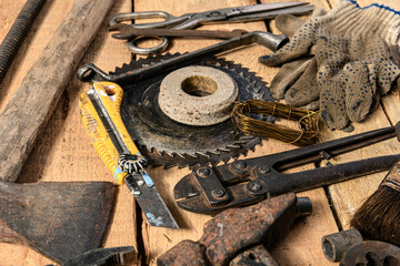 Old vintage household hand tools still life on a wooden background in a DIY and repair concept