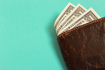 wallet with dollars on a blue background