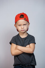 Boy with blue eyes on a gray background