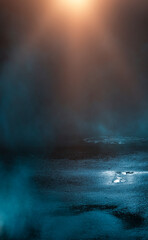 Dark street, wet asphalt, reflections of rays in the water. Abstract dark blue background, smoke, smog. Empty dark scene, neon light, spotlights. Concrete floor