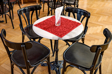 Fototapeta na wymiar Antique chairs around a table in a restaurant