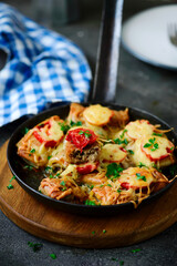 Crepes pie baked with cheese and tomatoes. selective focus