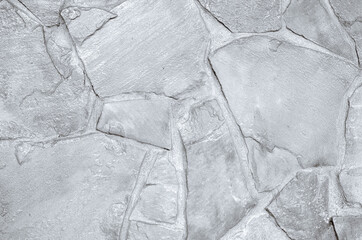 Light grey slate background or texture. White stone wall background