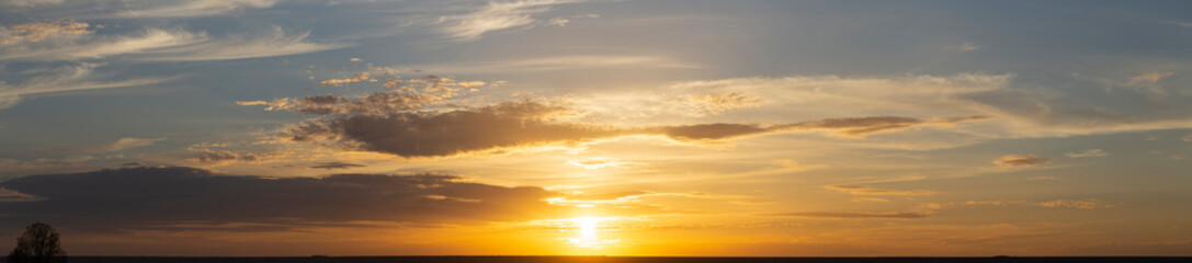 The evening sunset. Panorama. Majestic Storm Clouds. Tragic gloomy sky.