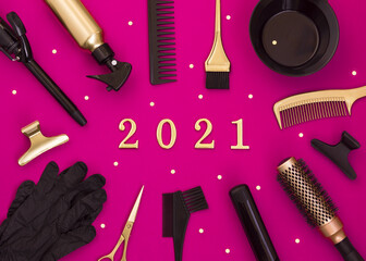 New year's background with hairdressing tools and numbers 2021. Scissors, combs, clips and Curling irons.