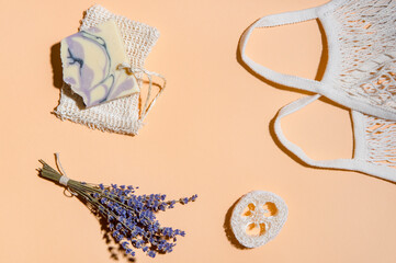 Top view of different hygiene and care items on cream color background, zero waste concept.