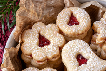 Linzer Christmas cookies filled with red currant marmalade, close up