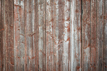 Old worn wooden wall with pain almost peeled off