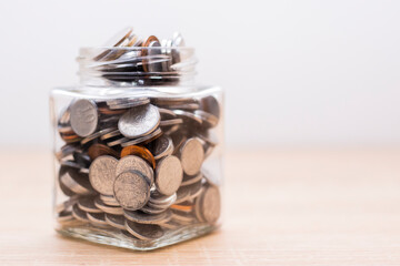 Jar full of coins. Save finance concept. Economy wealth or investment success.