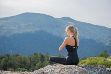 Naklejka na ściany i meble woman meditating yoga mountain postures