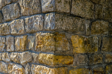 Yellow ancient sandstone brick wall background