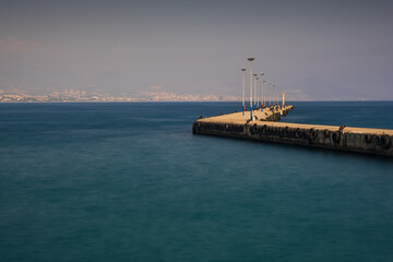 Alanya, Turkey - august 2020: Alanya Bay pier and promenade. Resort town in Turkey. Long exposure picture
