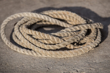 Obraz premium Old hemp rope coiled in a circle