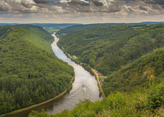river in the valley. View from above at Cloef of the river Saar in Germany, with a  boat passing...