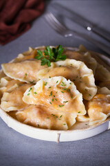 Dumplings, filled with cabbage. Pierogi, varenyky, vareniki, pyrohy - dumplings with filling, popular dish in many countries