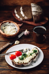 Rye bread toast with processed cheese, garlic and dill