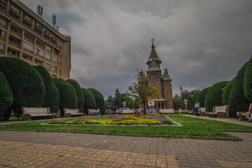 Fototapeta premium Orthodox cathedral in Timisoara, viewed from a park or a city square on a dull cloudy day.