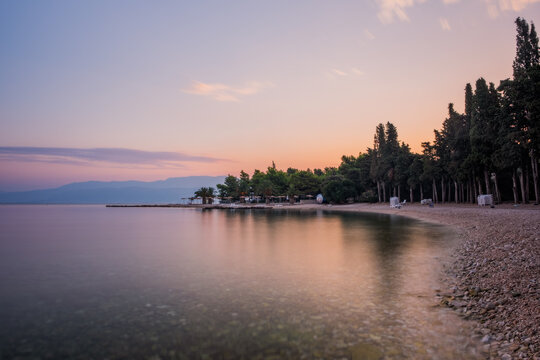 Croatia, Brac island, beach Supetrus at sunrise near Supetar. August 2020. Long exposure picture.