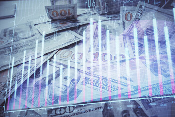 Multi exposure of forex chart drawing over us dollars bill background. Concept of financial success...