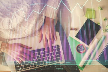 Multi exposure of woman hands working on computer and forex chart hologram drawing. Top View. Financial analysis concept.