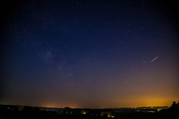 Milky Way Galaxy with stars and rural landscape