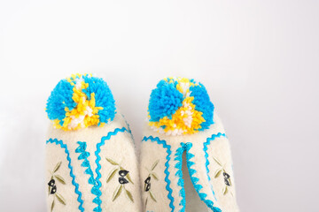 Part of greek slippers with pumpons
