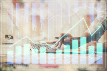 Multi exposure of woman hands typing on computer and financial chart hologram drawing. Stock market analysis concept.