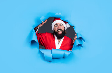 Being surprised. happy new year. merry christmas. cheerful bearded man in santa claus costume....