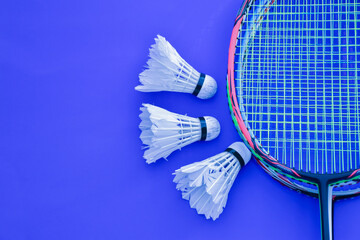 Badminton rackets and badminton shuttlecocks feather balls.