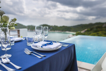 Blue and Silver Romantic Wedding Table Top Layout Table Spread no people no human tropical location with the sea with copy space