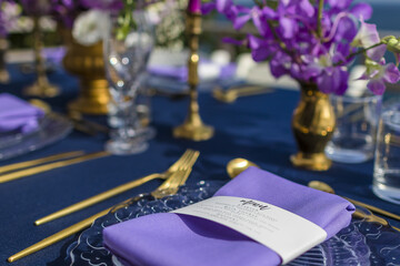 Purple and Gold Romantic Wedding Table Top Layout Table Spread no people no human tropical location copy space sea view trees and jungle ocean
