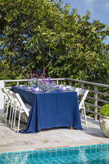 Obraz na płótnie Canvas Purple and Gold Romantic Wedding Table Top Layout Table Spread no people no human tropical location copy space sea view trees and jungle ocean