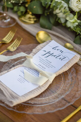 Romantic Wedding Table Top Layout Table Spread no people no human tropical location with gold cutlery and scenic view