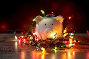 piggy bank with Christmas string lights on happy December festival, Enjoy savings for spending money on the holiday's concept